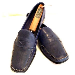 Navy Cole Haan textured flats with light stitching